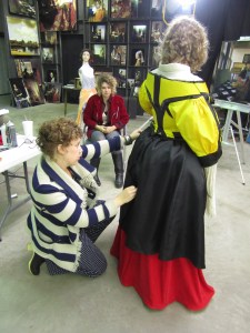 Tim Jenisons daughters, Natalie, Luren, and Claire, fitting Claires costume so Tim can paint her as the female model in his Music Lesson. © 2013 Tim Jenison. Used with Permission. All Rights Reserved.